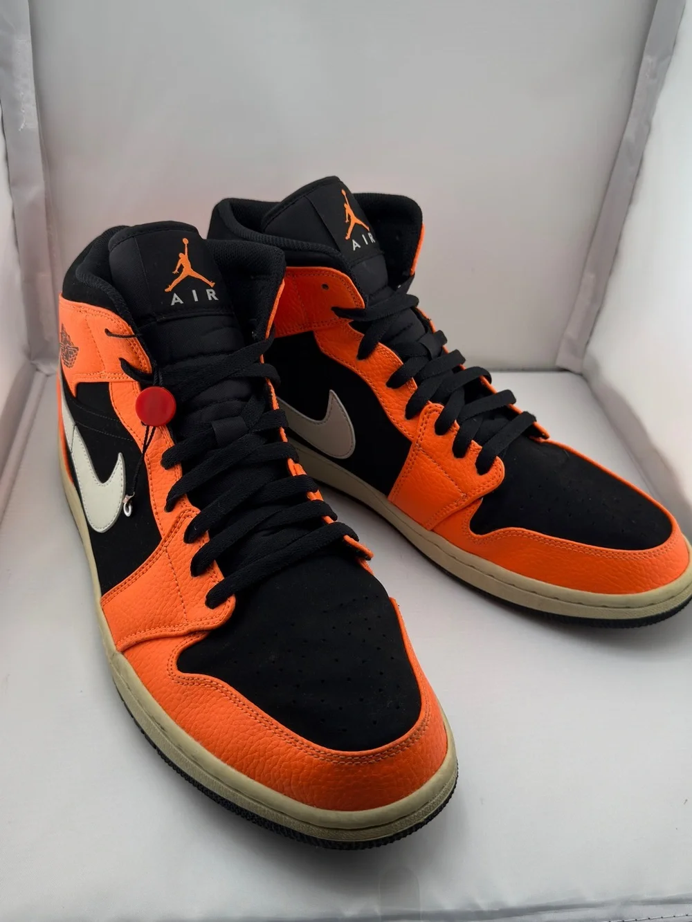 Jordan Black and Orange Mid-Top Sneakers with Cream Swoosh
